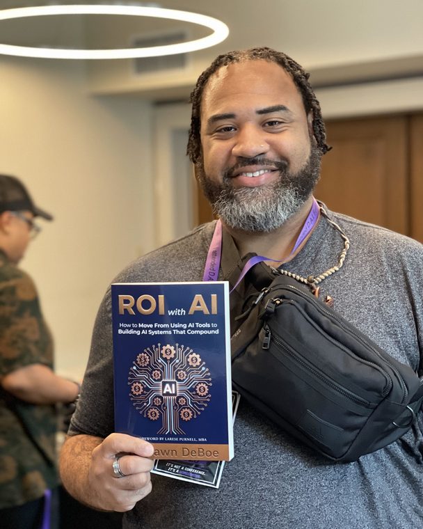 Reader holding a pre-sale copy of ROI with AI