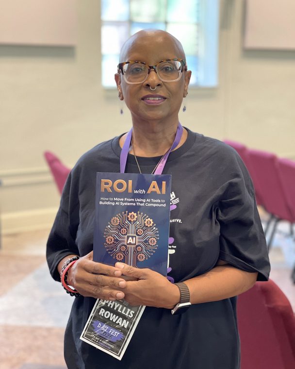 Reader holding a pre-sale copy of ROI with AI