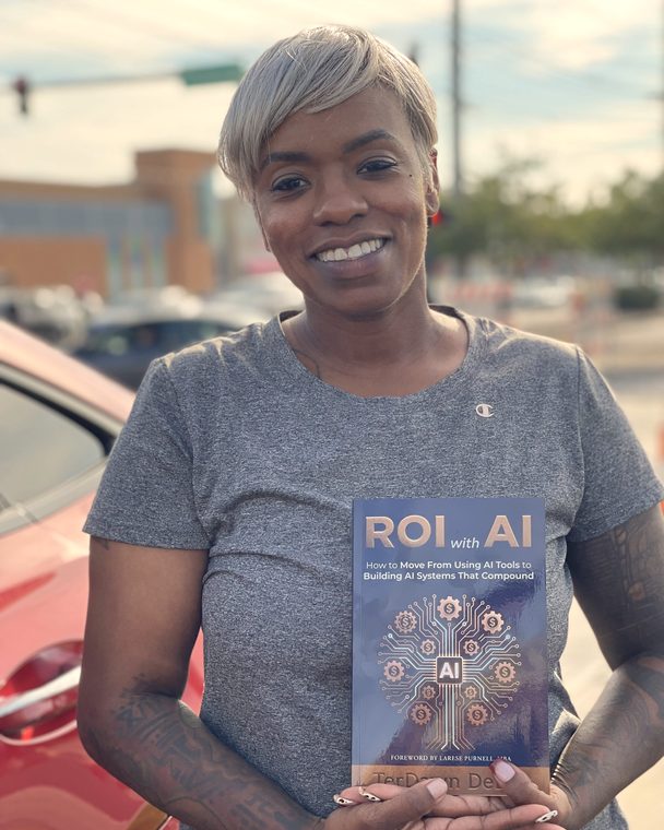 Reader holding a pre-sale copy of ROI with AI